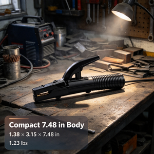 A black welding clamp tool resting on a rustic wooden workbench in a workshop setting, with a welding machine, tools, and a lamp in the background. Text overlay at the bottom left reads: 'Compact 7.